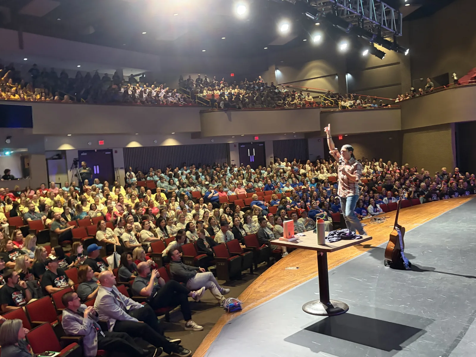 A full room of professionals at a live event