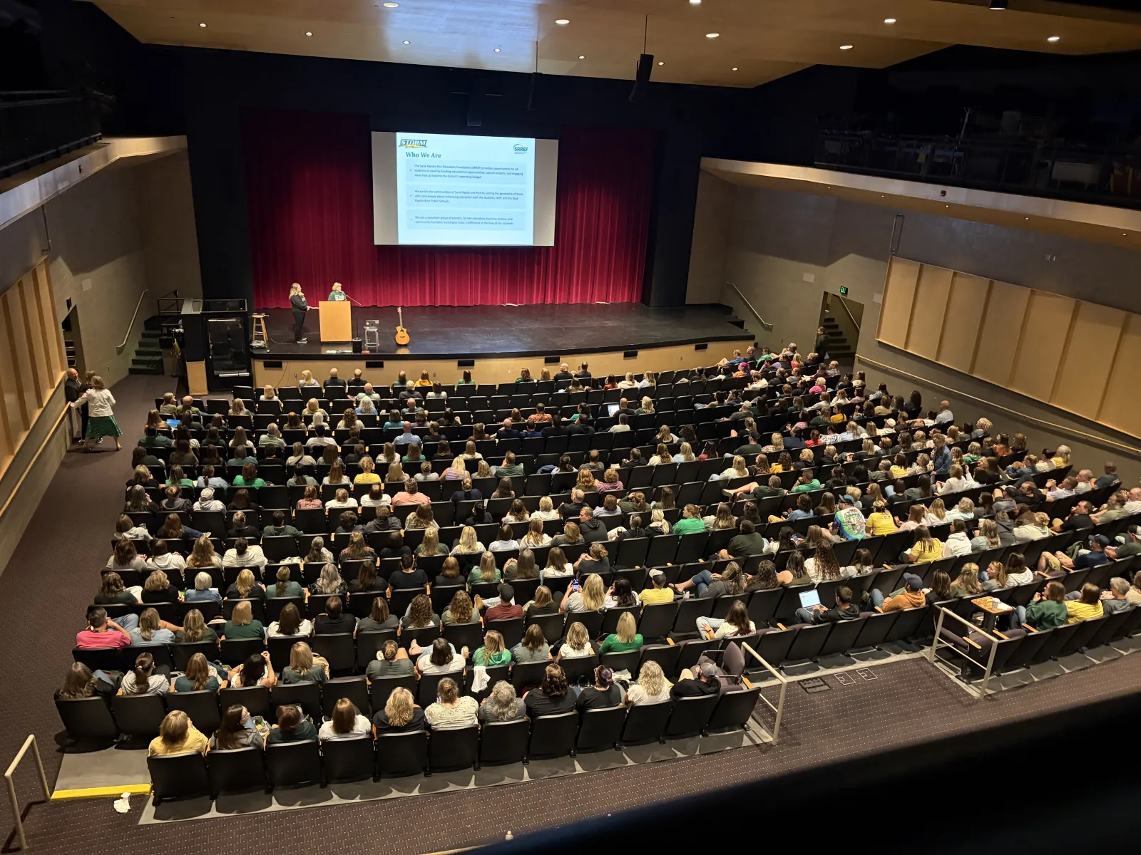 Educators gathered in a school auditorium